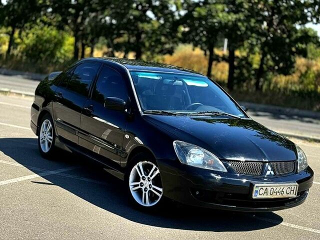 Чорний Міцубісі Lancer, об'ємом двигуна 2 л та пробігом 0 тис. км за 3500 $, фото 2 на Automoto.ua