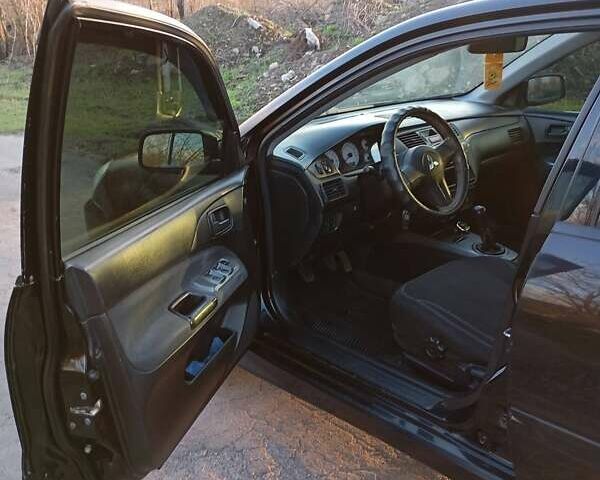 Чорний Міцубісі Lancer, об'ємом двигуна 1.6 л та пробігом 325 тис. км за 4750 $, фото 15 на Automoto.ua