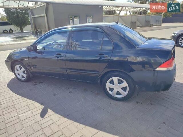Чорний Міцубісі Lancer, об'ємом двигуна 1.58 л та пробігом 128 тис. км за 4600 $, фото 25 на Automoto.ua