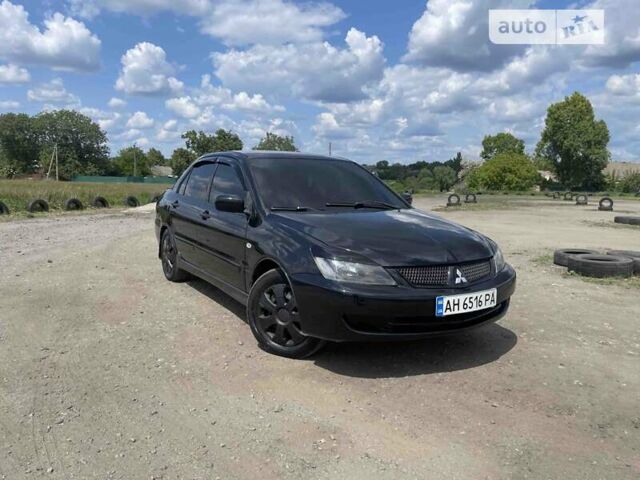 Чорний Міцубісі Lancer, об'ємом двигуна 1.58 л та пробігом 347 тис. км за 4500 $, фото 10 на Automoto.ua