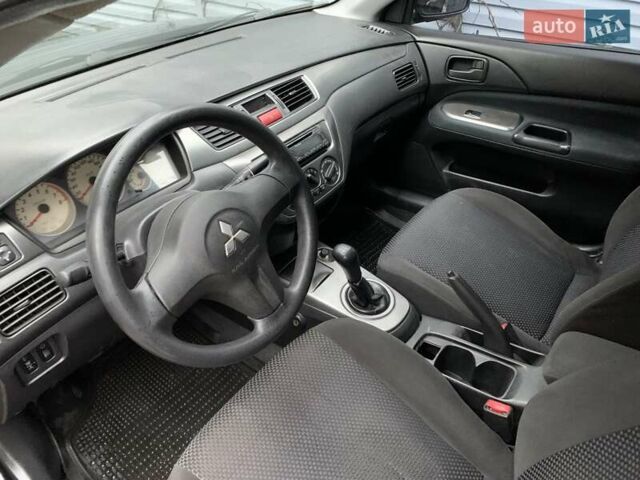 Чорний Міцубісі Lancer, об'ємом двигуна 1.58 л та пробігом 270 тис. км за 3950 $, фото 8 на Automoto.ua
