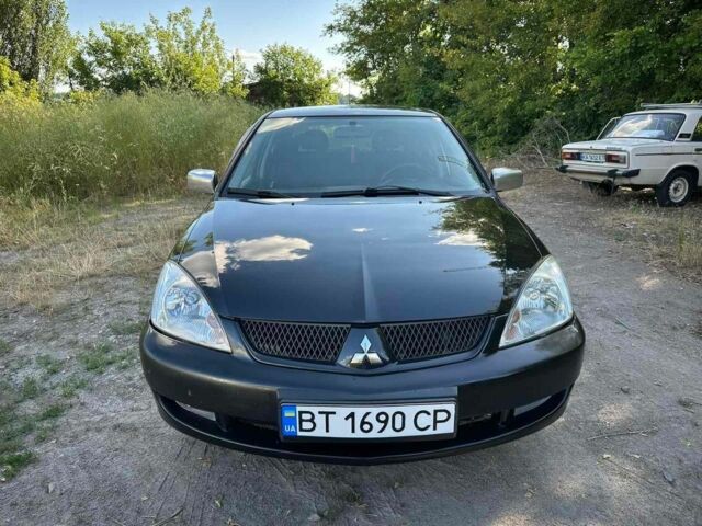 Черный Мицубиси Лансер, объемом двигателя 1.6 л и пробегом 289 тыс. км за 3200 $, фото 2 на Automoto.ua