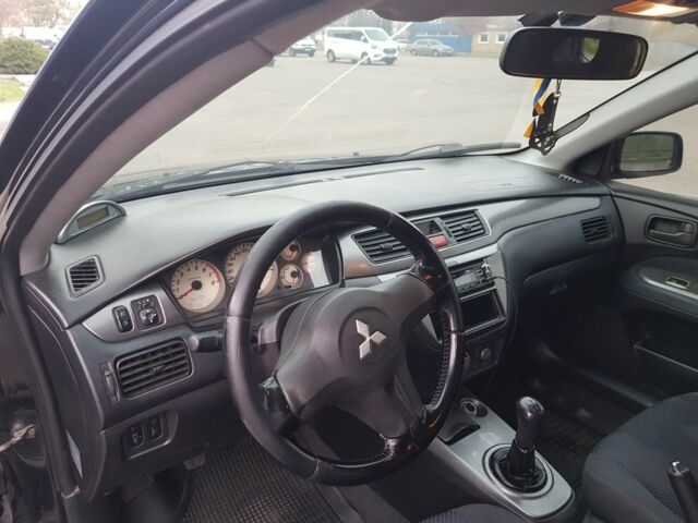 Черный Мицубиси Лансер, объемом двигателя 1.6 л и пробегом 290 тыс. км за 3200 $, фото 5 на Automoto.ua