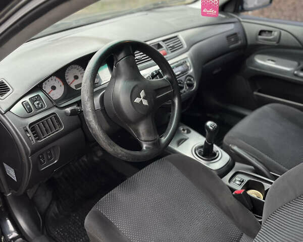 Чорний Міцубісі Lancer, об'ємом двигуна 1.58 л та пробігом 230 тис. км за 3350 $, фото 8 на Automoto.ua