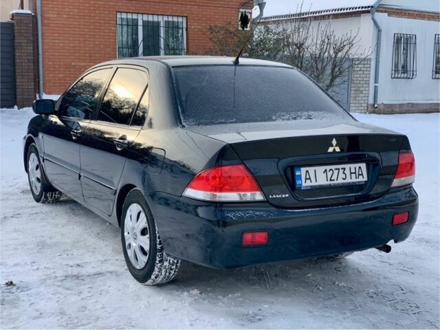 Чорний Міцубісі Lancer, об'ємом двигуна 1.6 л та пробігом 237 тис. км за 3850 $, фото 5 на Automoto.ua