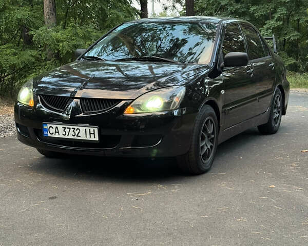 Чорний Міцубісі Lancer, об'ємом двигуна 1.6 л та пробігом 375 тис. км за 4500 $, фото 1 на Automoto.ua