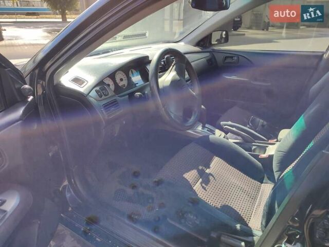 Чорний Міцубісі Lancer, об'ємом двигуна 1.58 л та пробігом 128 тис. км за 4600 $, фото 23 на Automoto.ua