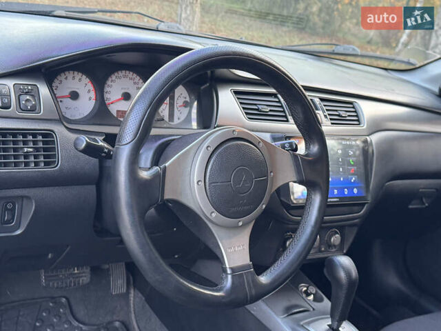 Міцубісі Lancer 2006 у Дніпро (Дніпропетровську) на Automoto.ua Чорний Міцубісі Lancer, об'ємом двигуна 2 л та пробігом 230 тис. км за 4900 $, фото 17 на Automoto.ua