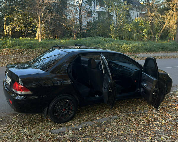 Черный Мицубиси Лансер, объемом двигателя 1.6 л и пробегом 233 тыс. км за 3650 $, фото 13 на Automoto.ua