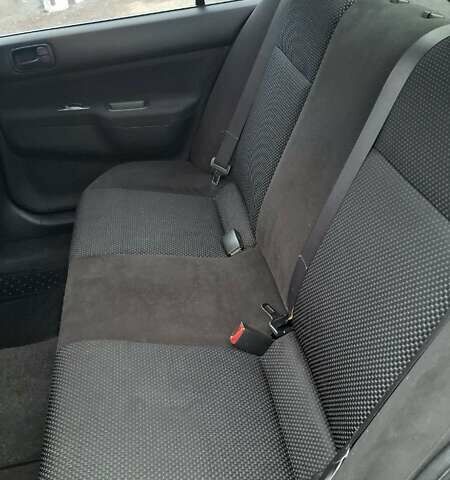 Черный Мицубиси Лансер, объемом двигателя 1.58 л и пробегом 246 тыс. км за 4200 $, фото 13 на Automoto.ua