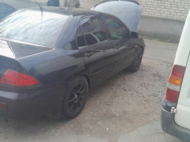 Черный Мицубиси Лансер, объемом двигателя 1.6 л и пробегом 260 тыс. км за 3800 $, фото 3 на Automoto.ua