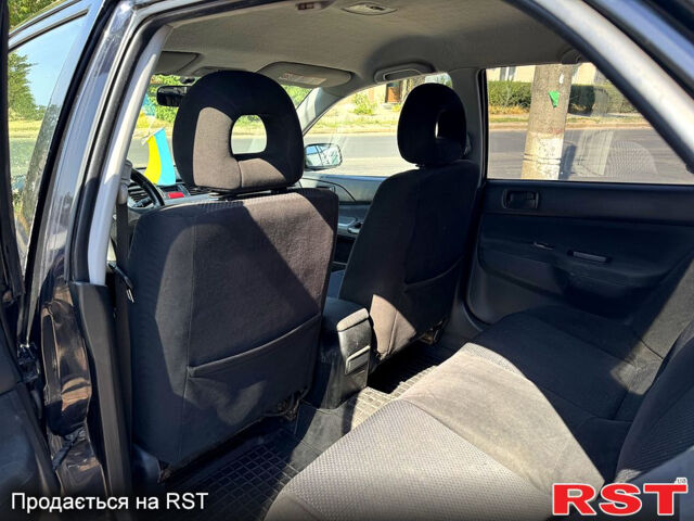 Черный Мицубиси Лансер, объемом двигателя 1.6 л и пробегом 300 тыс. км за 3599 $, фото 11 на Automoto.ua