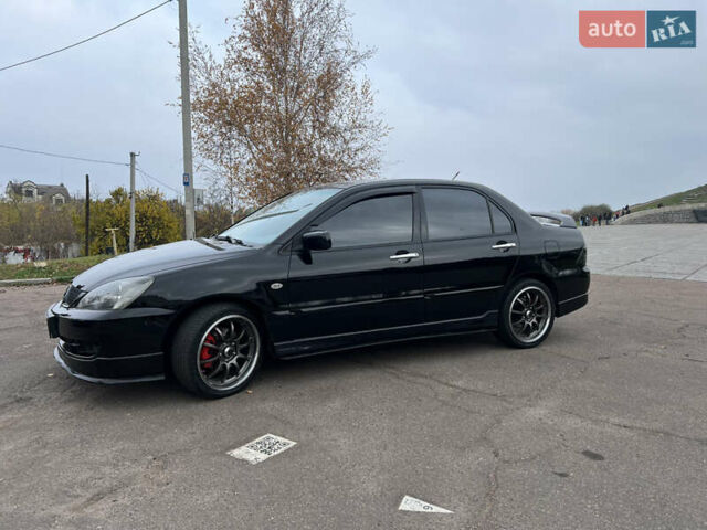 Чорний Міцубісі Lancer, об'ємом двигуна 2 л та пробігом 242 тис. км за 5900 $, фото 6 на Automoto.ua
