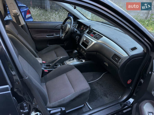 Черный Мицубиси Лансер, объемом двигателя 2 л и пробегом 255 тыс. км за 5000 $, фото 9 на Automoto.ua