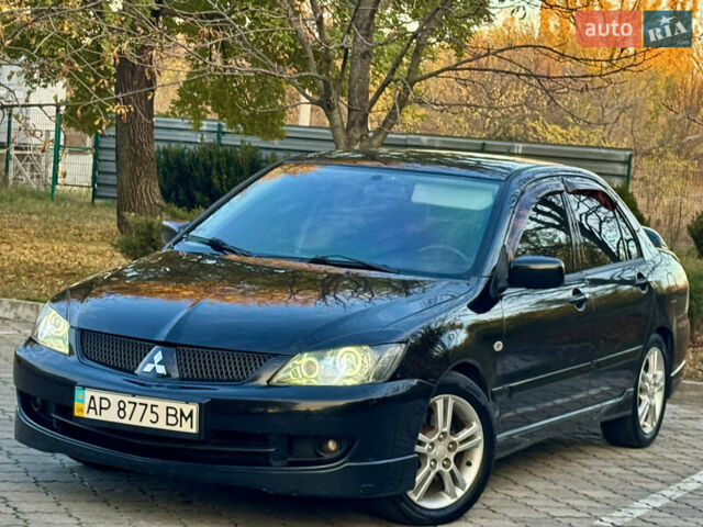 Міцубісі Lancer 2006 у Дніпро (Дніпропетровську) на Automoto.ua Чорний Міцубісі Lancer, об'ємом двигуна 2 л та пробігом 230 тис. км за 4900 $, фото 3 на Automoto.ua