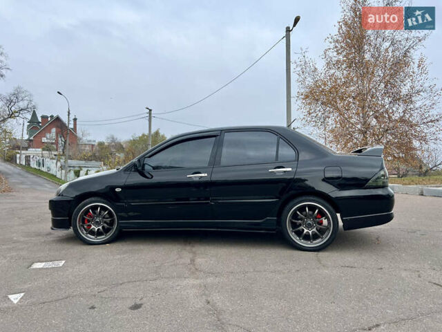 Чорний Міцубісі Lancer, об'ємом двигуна 2 л та пробігом 242 тис. км за 5900 $, фото 5 на Automoto.ua