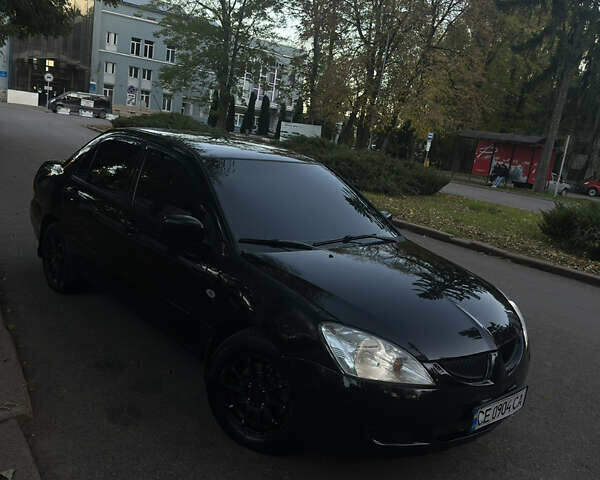 Черный Мицубиси Лансер, объемом двигателя 1.6 л и пробегом 233 тыс. км за 3650 $, фото 8 на Automoto.ua