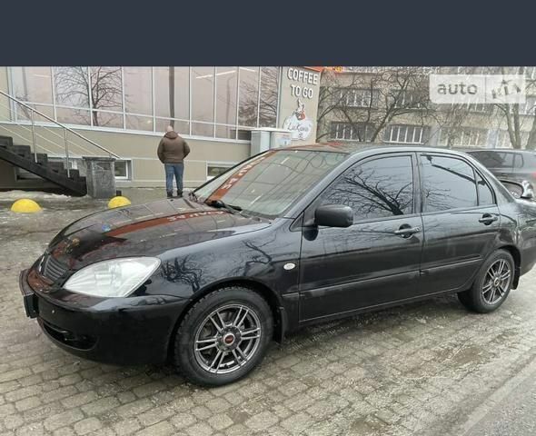 Черный Мицубиси Лансер, объемом двигателя 1.6 л и пробегом 200 тыс. км за 4200 $, фото 3 на Automoto.ua