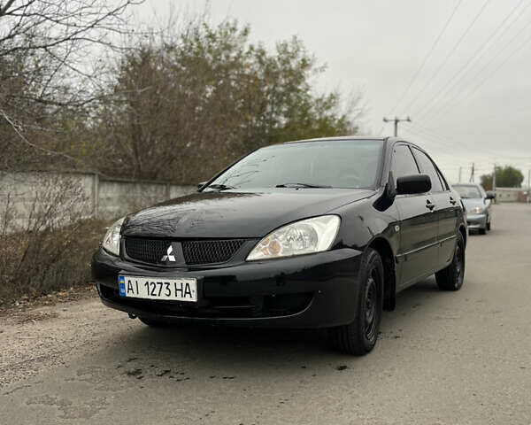Чорний Міцубісі Lancer, об'ємом двигуна 1.58 л та пробігом 230 тис. км за 3350 $, фото 1 на Automoto.ua