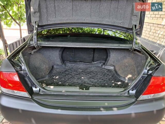 Чорний Міцубісі Lancer, об'ємом двигуна 1.58 л та пробігом 280 тис. км за 3950 $, фото 24 на Automoto.ua