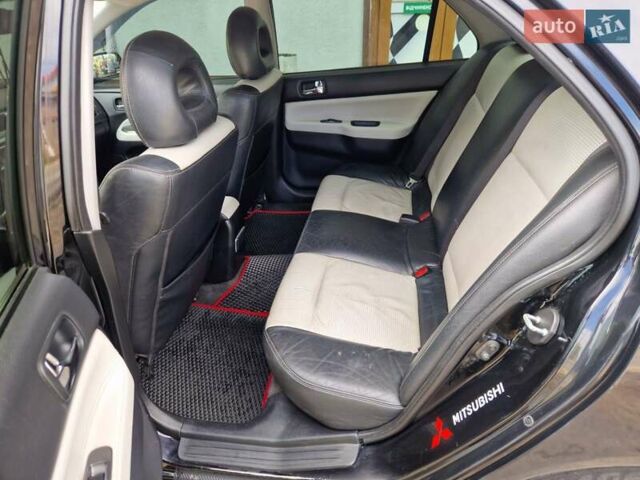 Черный Мицубиси Лансер, объемом двигателя 2 л и пробегом 168 тыс. км за 4999 $, фото 18 на Automoto.ua