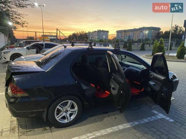 Черный Мицубиси Лансер, объемом двигателя 1.6 л и пробегом 257 тыс. км за 4500 $, фото 2 на Automoto.ua