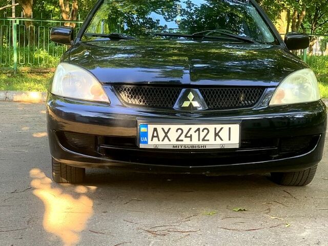 Черный Мицубиси Лансер, объемом двигателя 1.6 л и пробегом 285 тыс. км за 4400 $, фото 2 на Automoto.ua