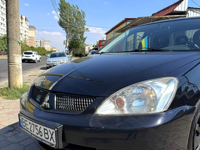 Черный Мицубиси Лансер, объемом двигателя 1.6 л и пробегом 300 тыс. км за 3599 $, фото 3 на Automoto.ua