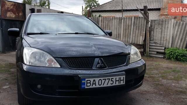 Чорний Міцубісі Lancer, об'ємом двигуна 1.59 л та пробігом 185 тис. км за 4900 $, фото 9 на Automoto.ua