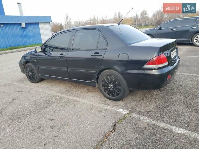 Чорний Міцубісі Lancer, об'ємом двигуна 1.58 л та пробігом 290 тис. км за 3200 $, фото 11 на Automoto.ua