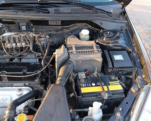 Чорний Міцубісі Lancer, об'ємом двигуна 1.6 л та пробігом 325 тис. км за 4750 $, фото 4 на Automoto.ua