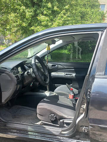 Чорний Міцубісі Lancer, об'ємом двигуна 1.58 л та пробігом 277 тис. км за 3900 $, фото 1 на Automoto.ua
