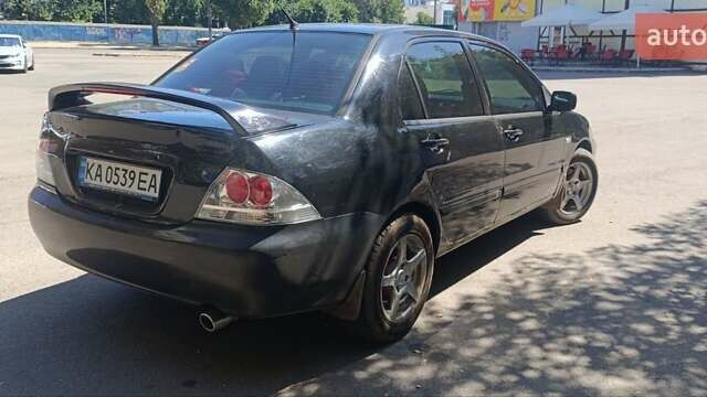 Чорний Міцубісі Lancer, об'ємом двигуна 1.6 л та пробігом 240 тис. км за 3900 $, фото 3 на Automoto.ua