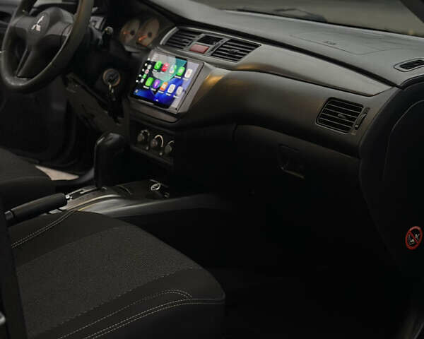 Чорний Міцубісі Lancer, об'ємом двигуна 1.58 л та пробігом 230 тис. км за 4350 $, фото 17 на Automoto.ua