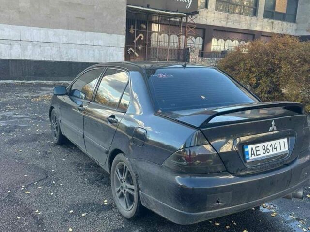 Черный Мицубиси Лансер, объемом двигателя 2 л и пробегом 200 тыс. км за 2999 $, фото 4 на Automoto.ua