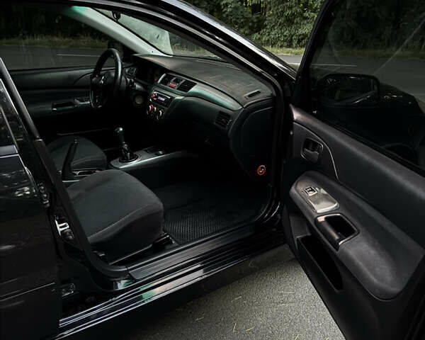 Чорний Міцубісі Lancer, об'ємом двигуна 1.6 л та пробігом 375 тис. км за 4500 $, фото 11 на Automoto.ua