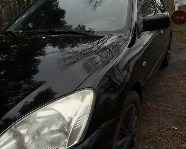 Чорний Міцубісі Lancer, об'ємом двигуна 1.58 л та пробігом 210 тис. км за 3900 $, фото 2 на Automoto.ua