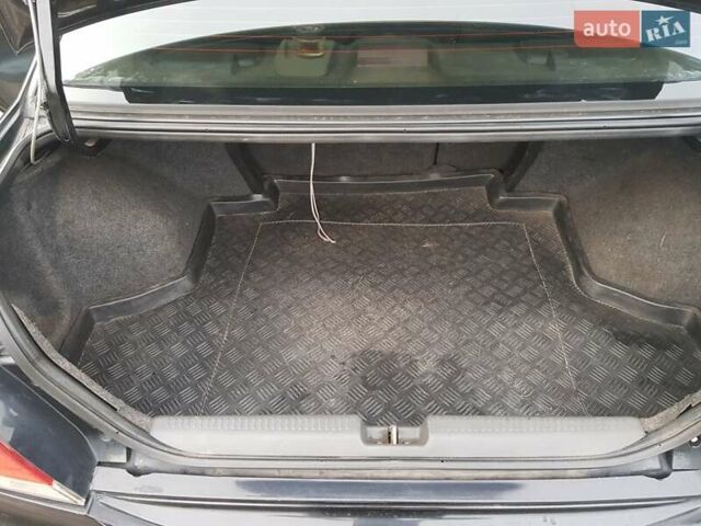 Чорний Міцубісі Lancer, об'ємом двигуна 1.58 л та пробігом 290 тис. км за 3200 $, фото 19 на Automoto.ua