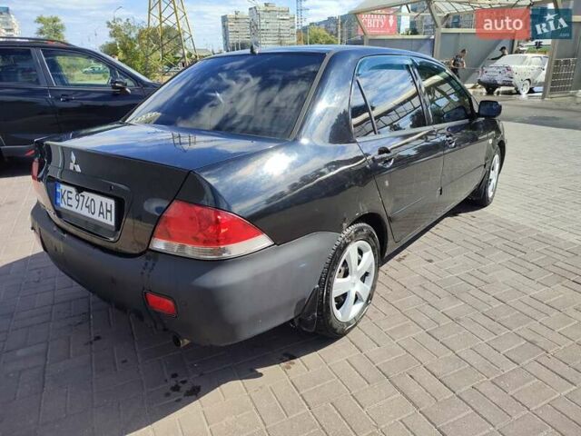 Чорний Міцубісі Lancer, об'ємом двигуна 1.58 л та пробігом 128 тис. км за 4600 $, фото 21 на Automoto.ua