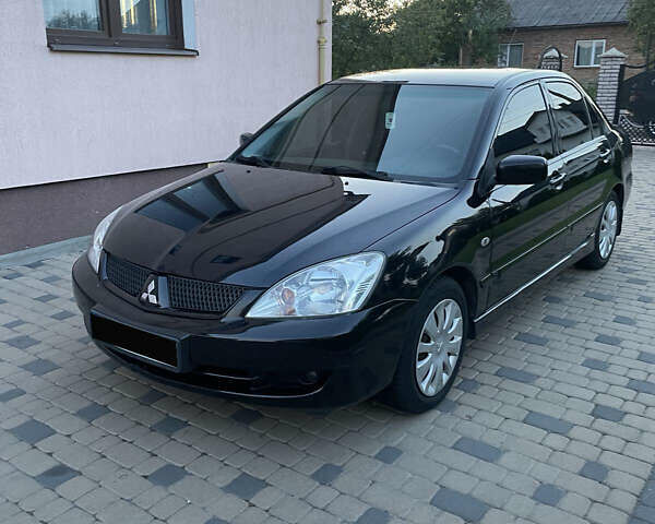 Чорний Міцубісі Lancer, об'ємом двигуна 1.6 л та пробігом 170 тис. км за 4900 $, фото 5 на Automoto.ua
