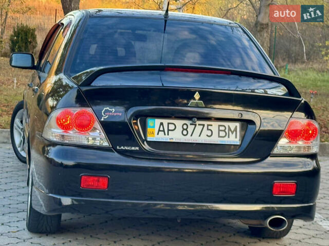 Міцубісі Lancer 2006 у Дніпро (Дніпропетровську) на Automoto.ua Чорний Міцубісі Lancer, об'ємом двигуна 2 л та пробігом 230 тис. км за 4900 $, фото 7 на Automoto.ua