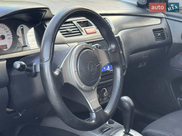 Міцубісі Lancer 2006 у Дніпро (Дніпропетровську) на Automoto.ua Чорний Міцубісі Lancer, об'ємом двигуна 2 л та пробігом 230 тис. км за 4900 $, фото 14 на Automoto.ua
