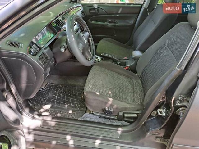 Чорний Міцубісі Lancer, об'ємом двигуна 1.58 л та пробігом 280 тис. км за 3950 $, фото 13 на Automoto.ua