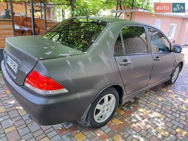 Чорний Міцубісі Lancer, об'ємом двигуна 1.58 л та пробігом 280 тис. км за 3950 $, фото 4 на Automoto.ua
