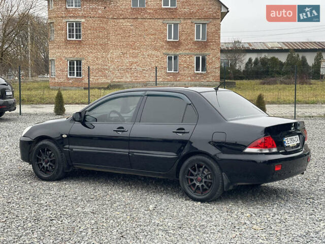 Чорний Міцубісі Lancer, об'ємом двигуна 1.58 л та пробігом 230 тис. км за 3350 $, фото 11 на Automoto.ua