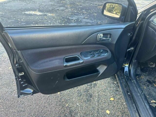 Черный Мицубиси Лансер, объемом двигателя 2 л и пробегом 200 тыс. км за 2999 $, фото 6 на Automoto.ua