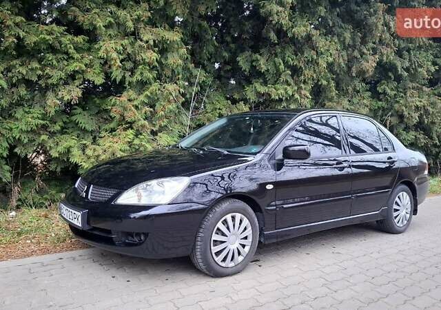 Черный Мицубиси Лансер, объемом двигателя 1.58 л и пробегом 246 тыс. км за 4200 $, фото 3 на Automoto.ua