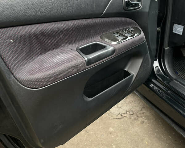 Чорний Міцубісі Lancer, об'ємом двигуна 2 л та пробігом 242 тис. км за 5900 $, фото 11 на Automoto.ua