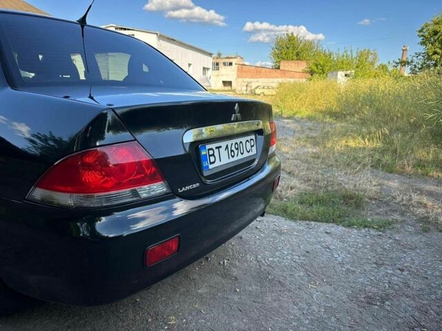 Черный Мицубиси Лансер, объемом двигателя 1.6 л и пробегом 289 тыс. км за 3200 $, фото 14 на Automoto.ua