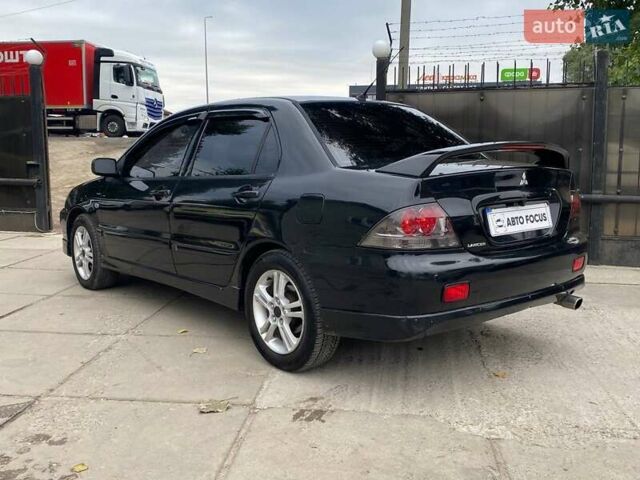Чорний Міцубісі Lancer, об'ємом двигуна 2 л та пробігом 248 тис. км за 4990 $, фото 4 на Automoto.ua